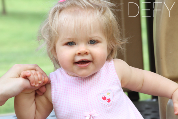 blonde baby girl on slide