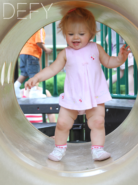 little girl playing on the playground