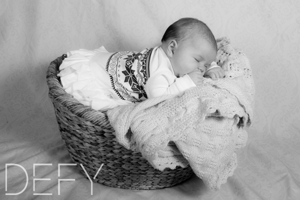 baby sleeping in a basket