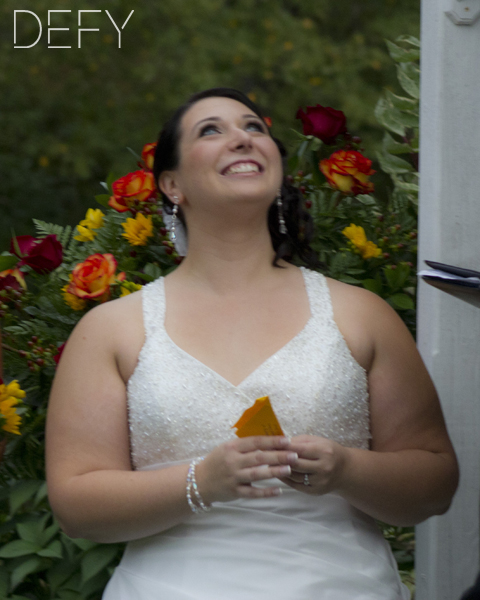 Bride releasing butterfly