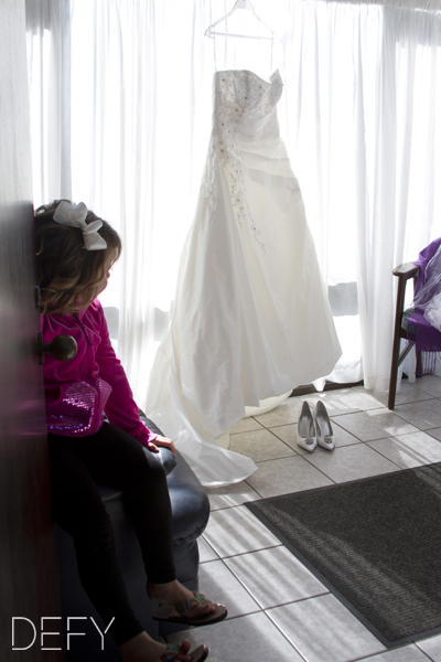 Flower girl with brides dress