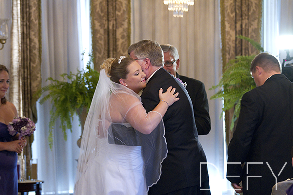 father giving bride away