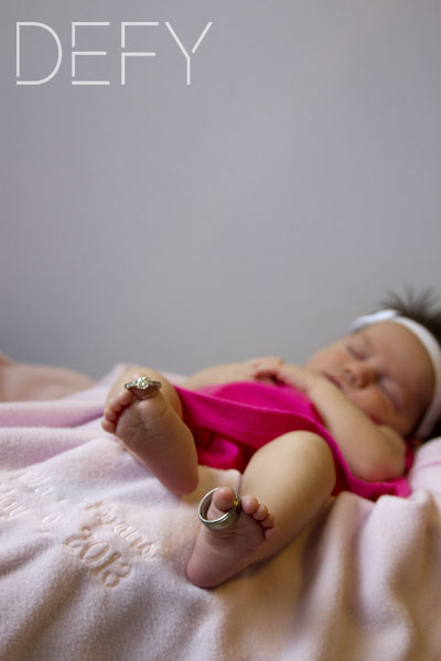 sleeping baby with rings on toes