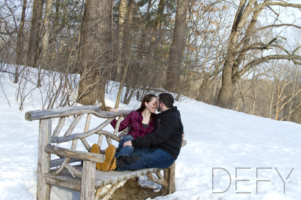 kissing on a wooden bench