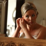 bride putting on earings